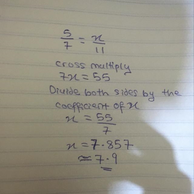 5/7 = x/11 round your answer to the nearest tenth.-example-1