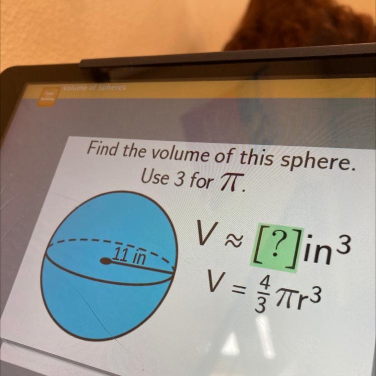 Hi i’m looking for some help Find the volume of this sphere. Use 3 for 7. V V~ [?]in-example-1