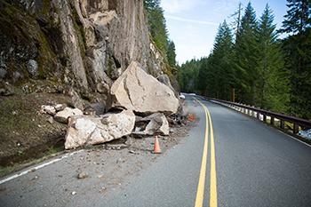 What statement describes how gravity causes erosion of a rock? It pulls the rocks-example-1