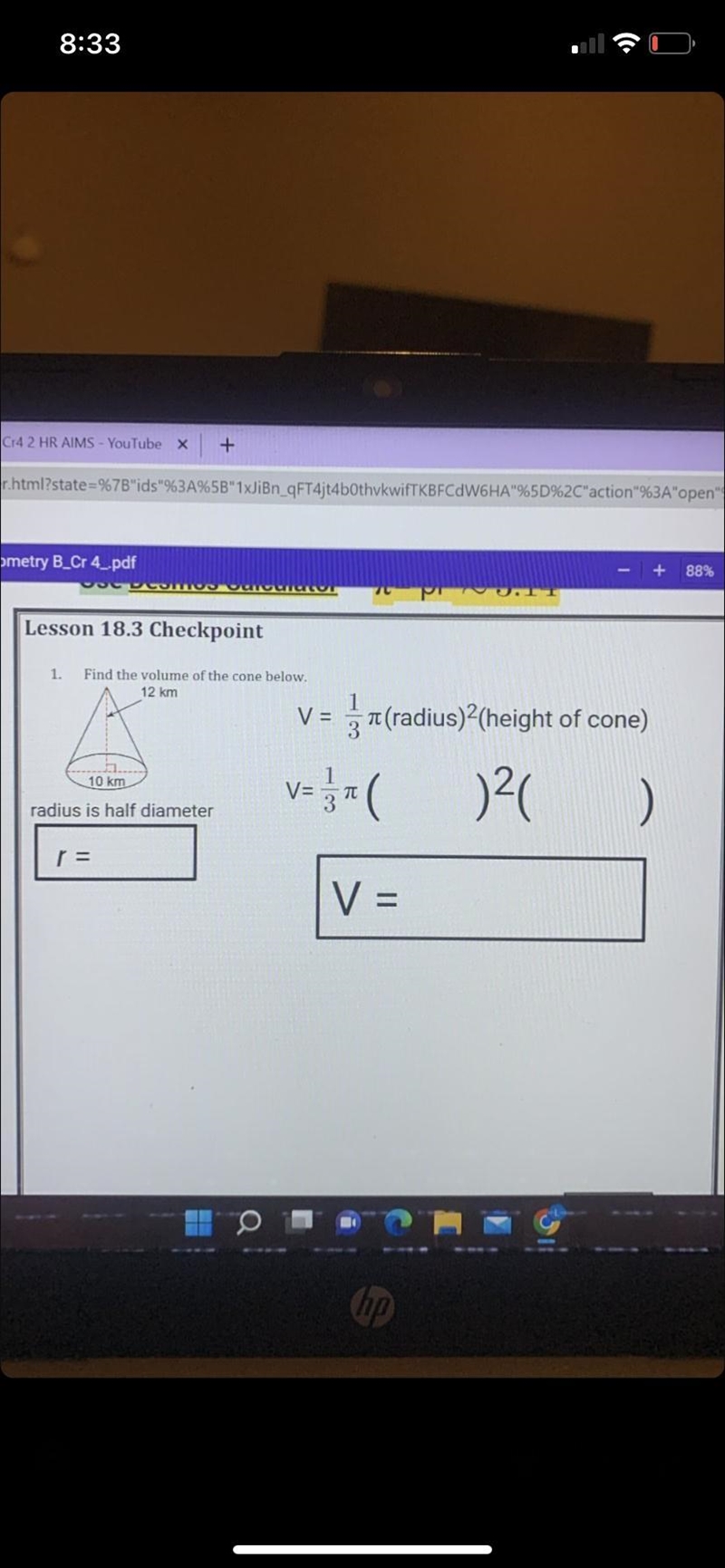 Find the volume of the cone below-example-1