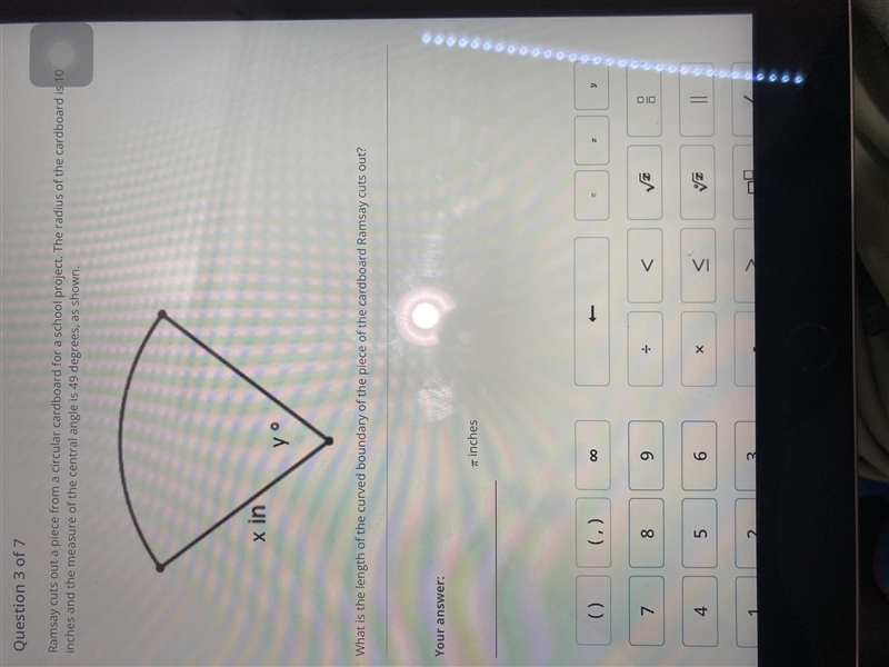 Ramsay cuts out a piece from a circular cardboard for a school project. The radius-example-1