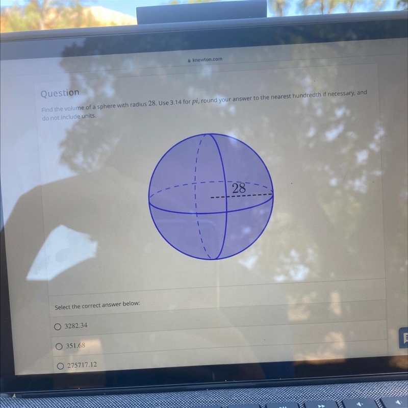 Find the volume of a sphere with radius 28. Use 3.14 for pi, round your answer to-example-1