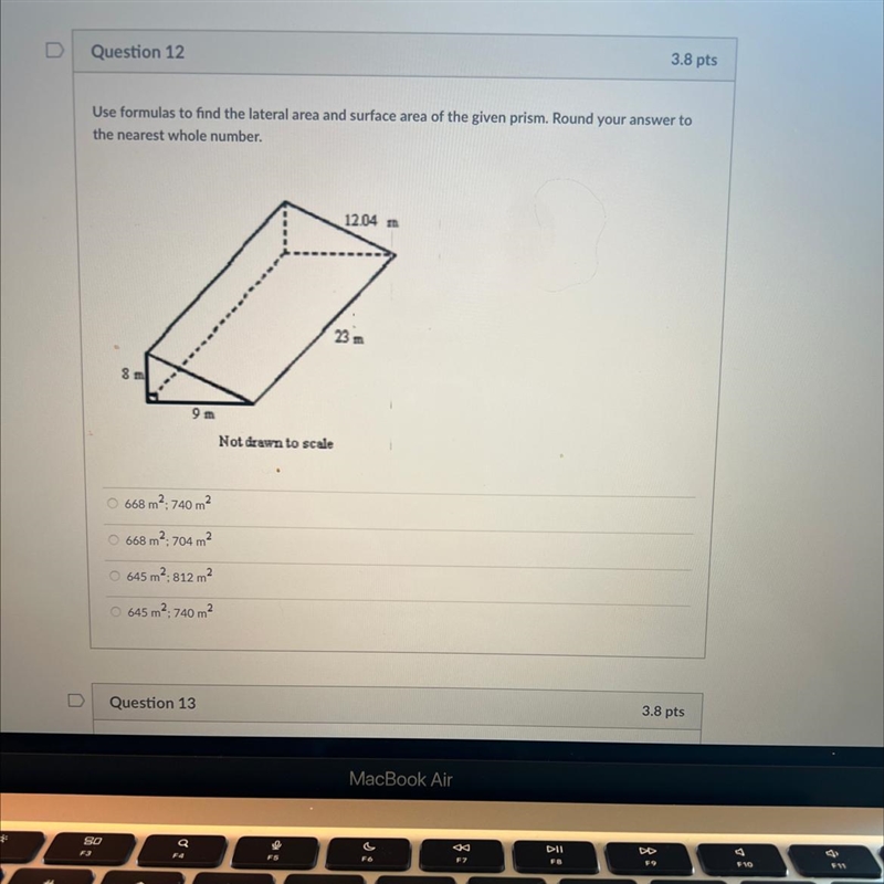 Use formulas to find the lateral area and surface area of the given prism. Round your-example-1