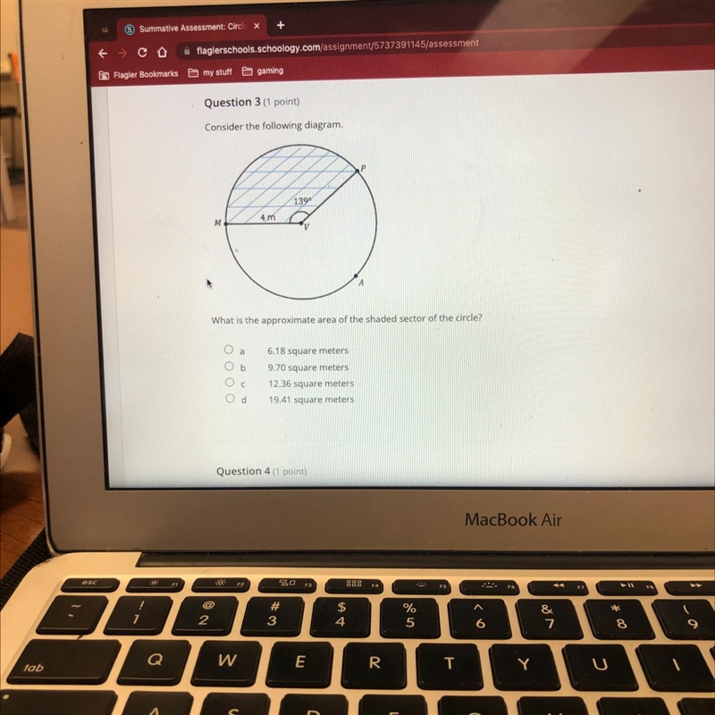 What is the approximate area of the shaded sector of the circle?-example-1