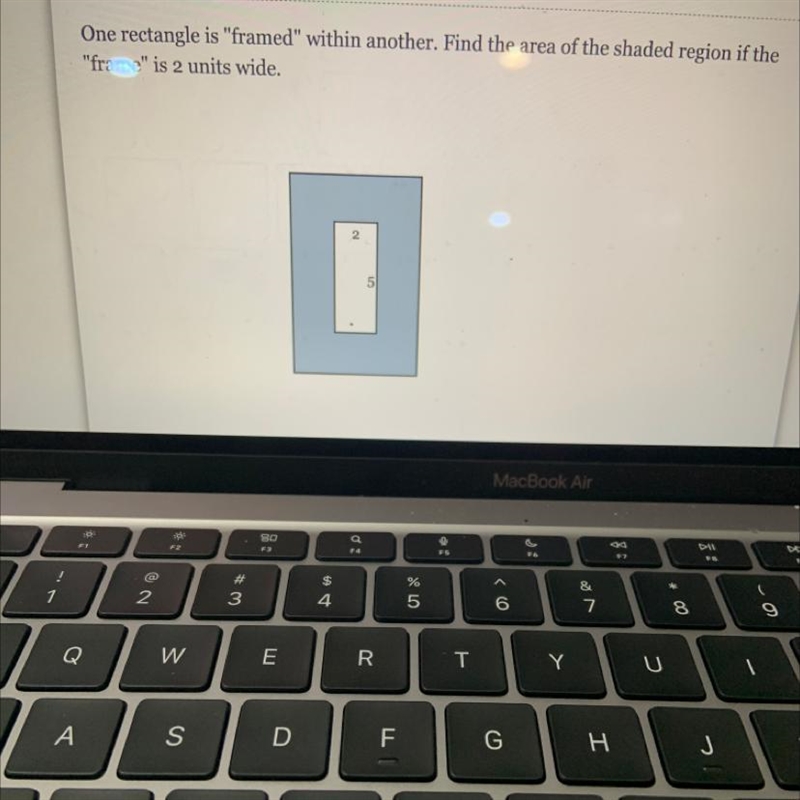 One rectangle is "framed" within another. Find the area of the shaded region-example-1