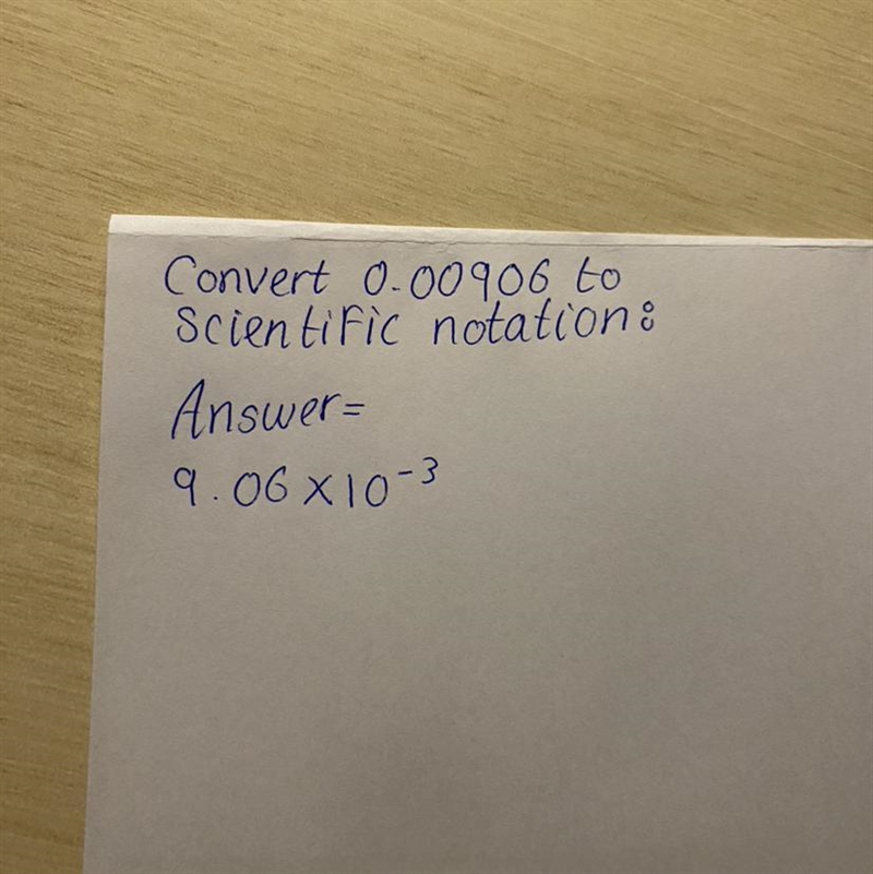 Convert 0.00906 to scientific notation.-example-1