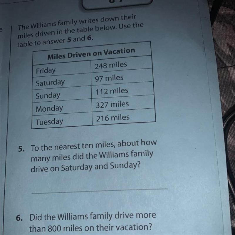 The Williams family writes down their miles driven in the table below. Use the table-example-1