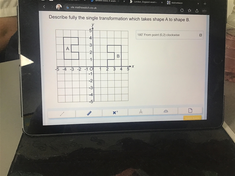 Describe fully the single transformation which takes shape A to shape B.-example-1