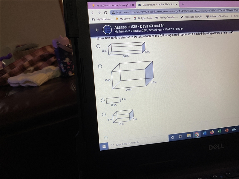 Carrie drew a scaled drawing of her fish tank below. If her fish tank is similar to-example-1