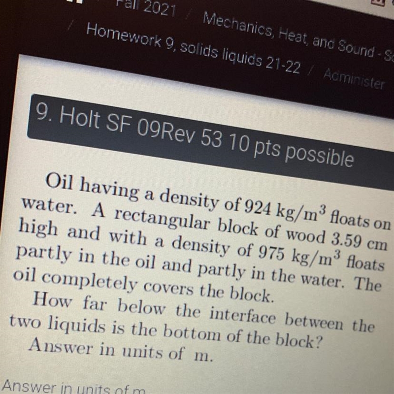 Oil having a density of 924 kg/m? floats onwater. A rectangular block of wood 3.59 cmhigh-example-1